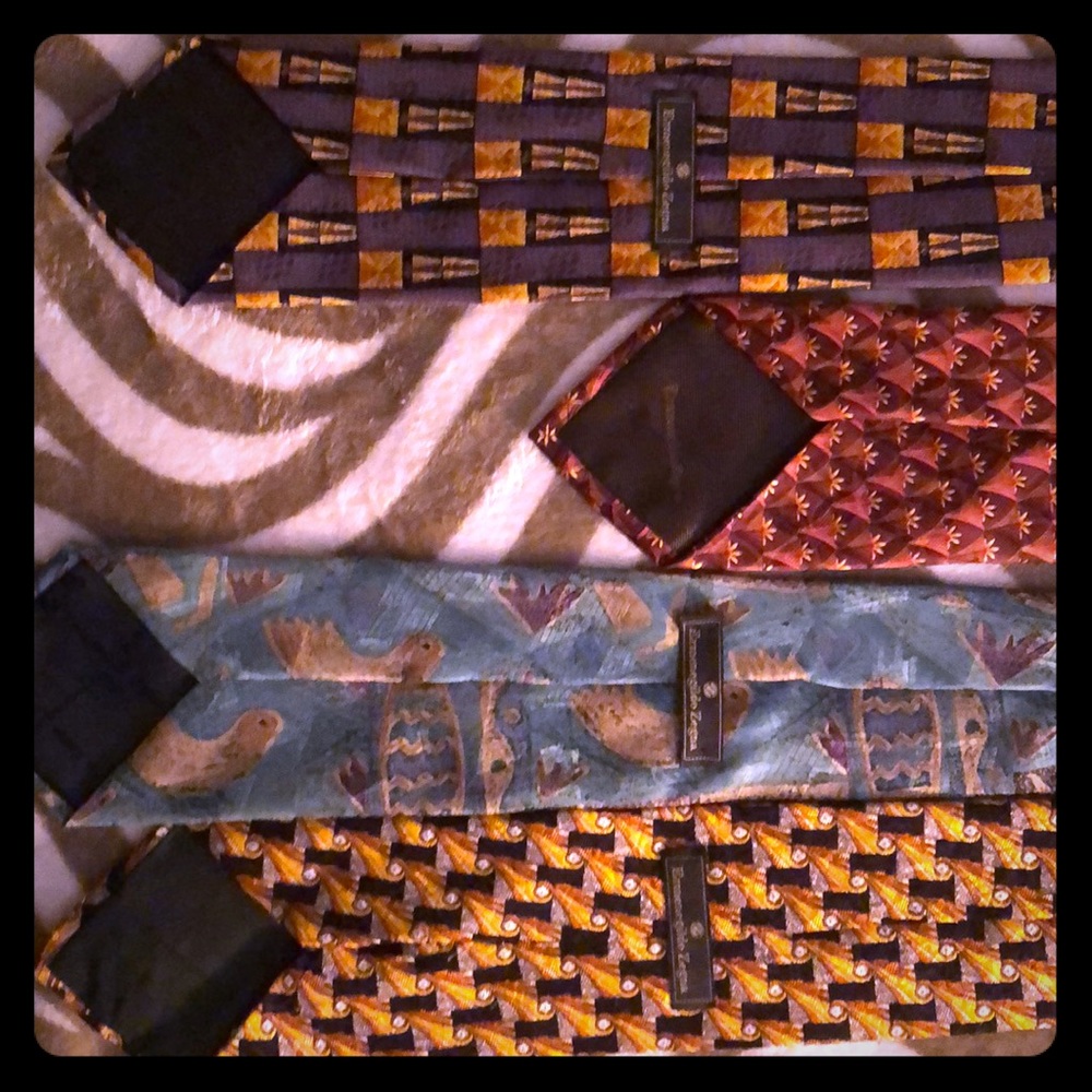 Four 100 percent silk, designer men’s ties.
